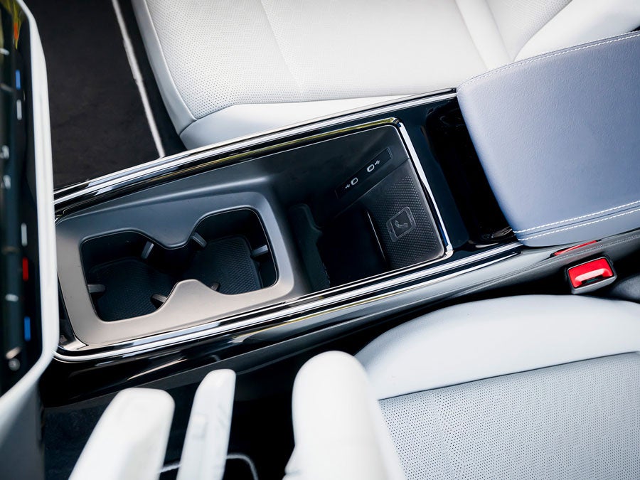 Close-up of the wireless phone charger and USB ports in the ID.4 center console.